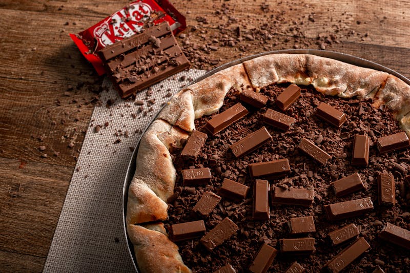 Burrata pizza with heirloom tomatoes and fresh basil