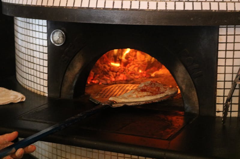 Traditional wood-burning pizza oven in our kitchen