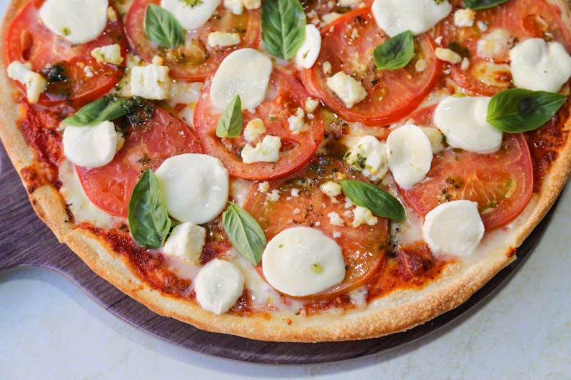 Classic Margherita pizza with fresh basil and mozzarella